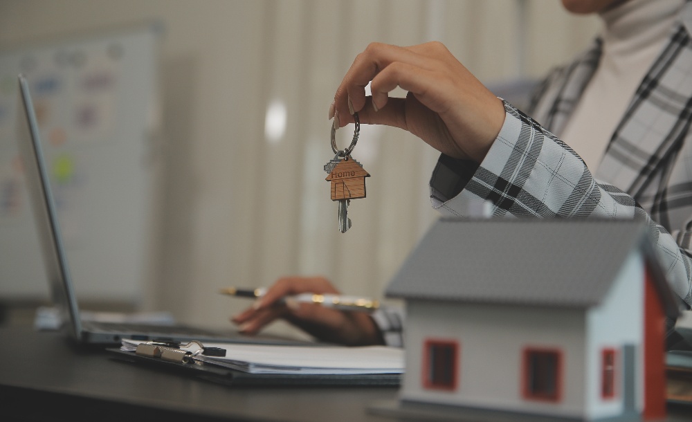 handing over key to new home