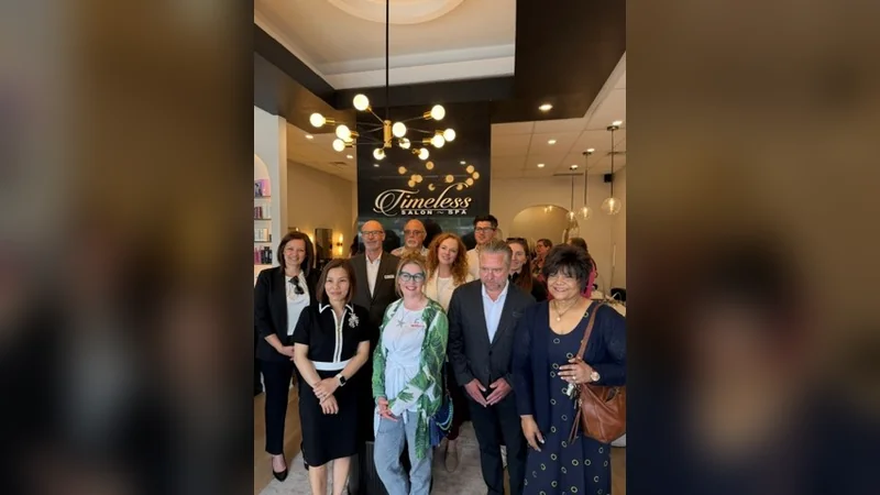 Kat Brazier with Halton Hills Chamber of Commerce members at the Timeless Salon & Spa ribbon cutting in Georgetown
