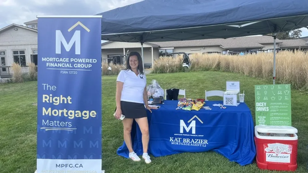 Kat Brazier at her Mortgage Powered Financial Group booth running Dicey Drives at the Halton Hills Twisters golf tournament